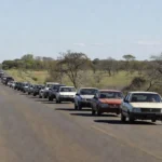 Carreata com veículos em estrada de Vilhena, Rondônia